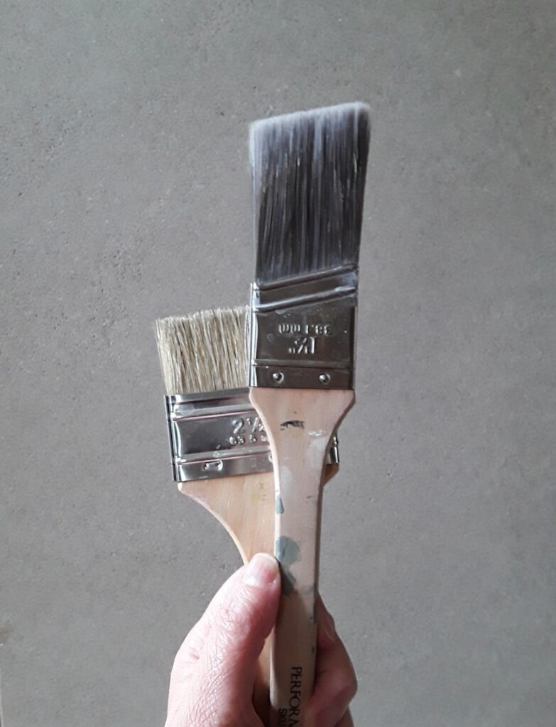 a hand holding a metal object